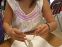 young girl dissecting squid